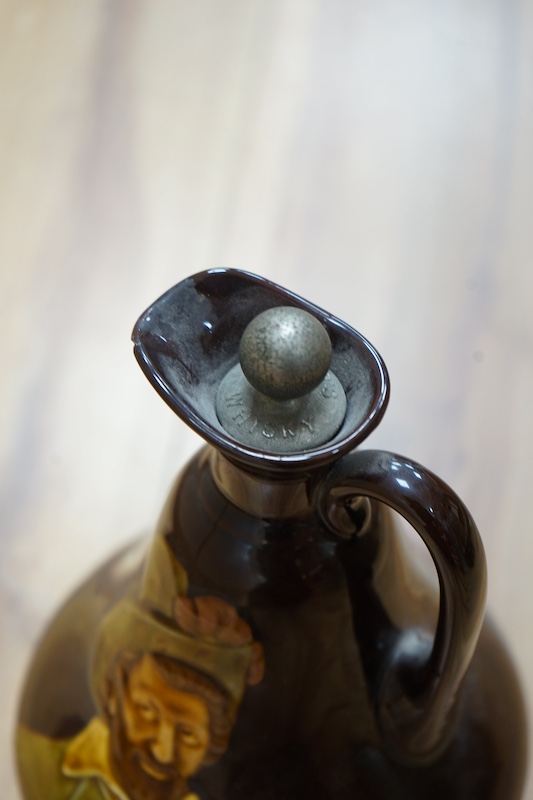 A Doulton Kingsware ewer and a Doulton stoneware jug, c.1882, tallest 29cm high. Condition - chip to Kingsware ewer lip and part of lozenge on body of jug missing, base of handle reglued and rim of jug crazed and split